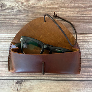 Hand stitched leather eyeglass case.